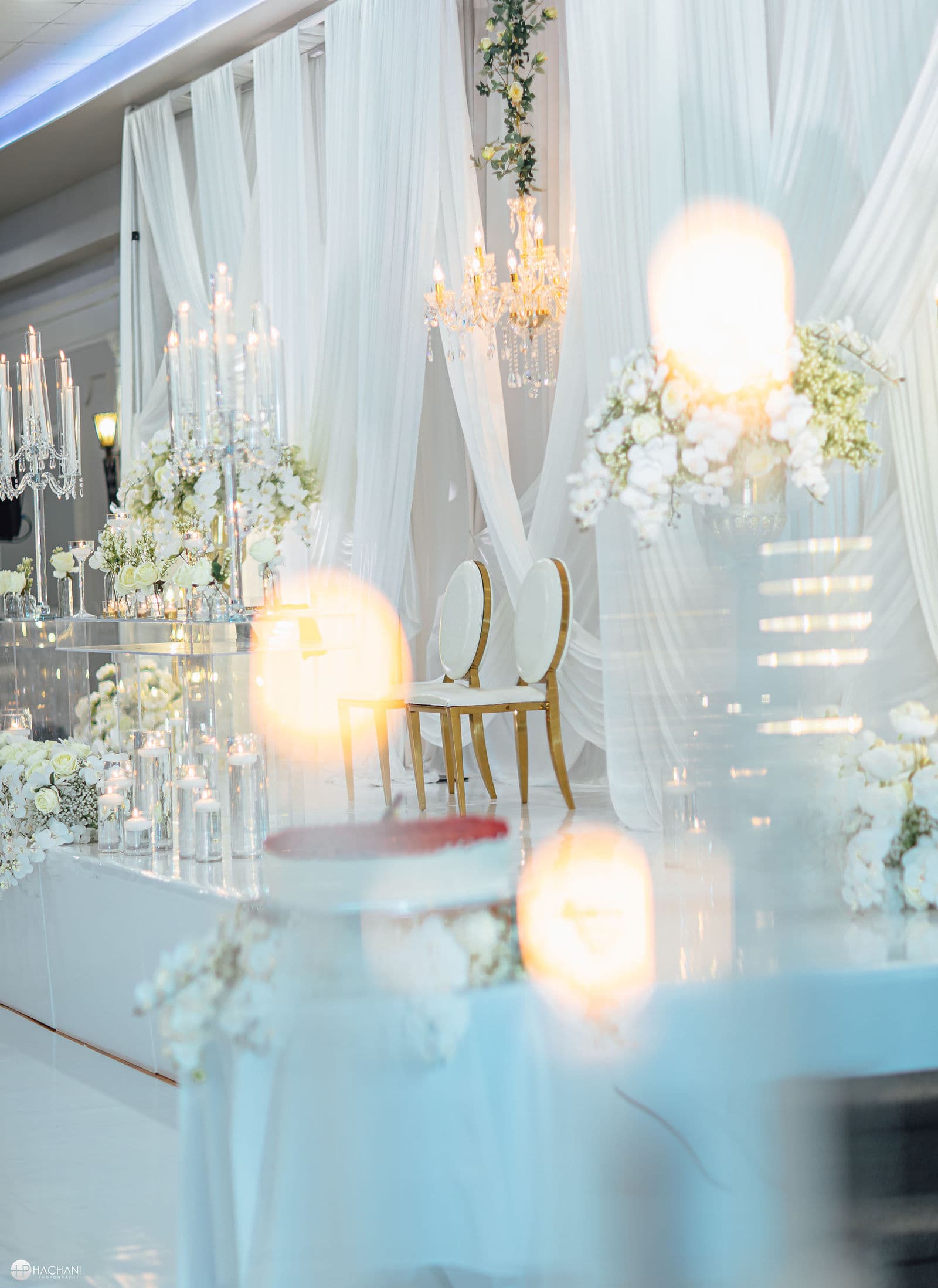 Candles and white flowers on a wedding reception table