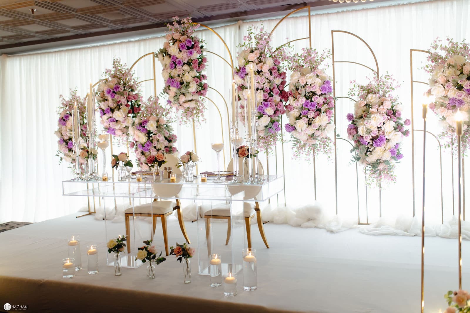 Floral wedding backdrop with sweetheart table