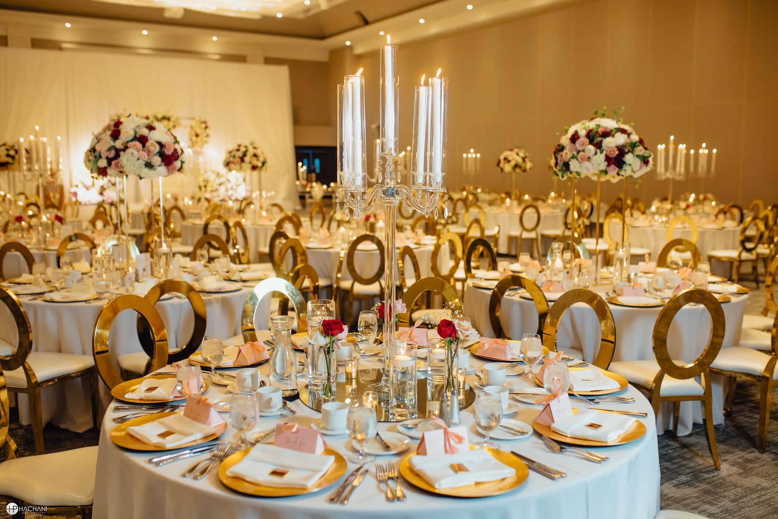 Wedding reception tables with candelabras and flowers